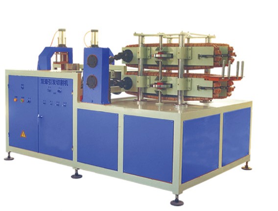 Double traction cutting machine